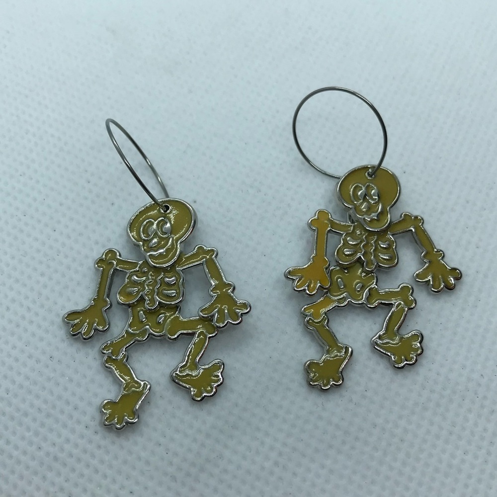 Avon glow-in-the-dark skeleton dance earrings